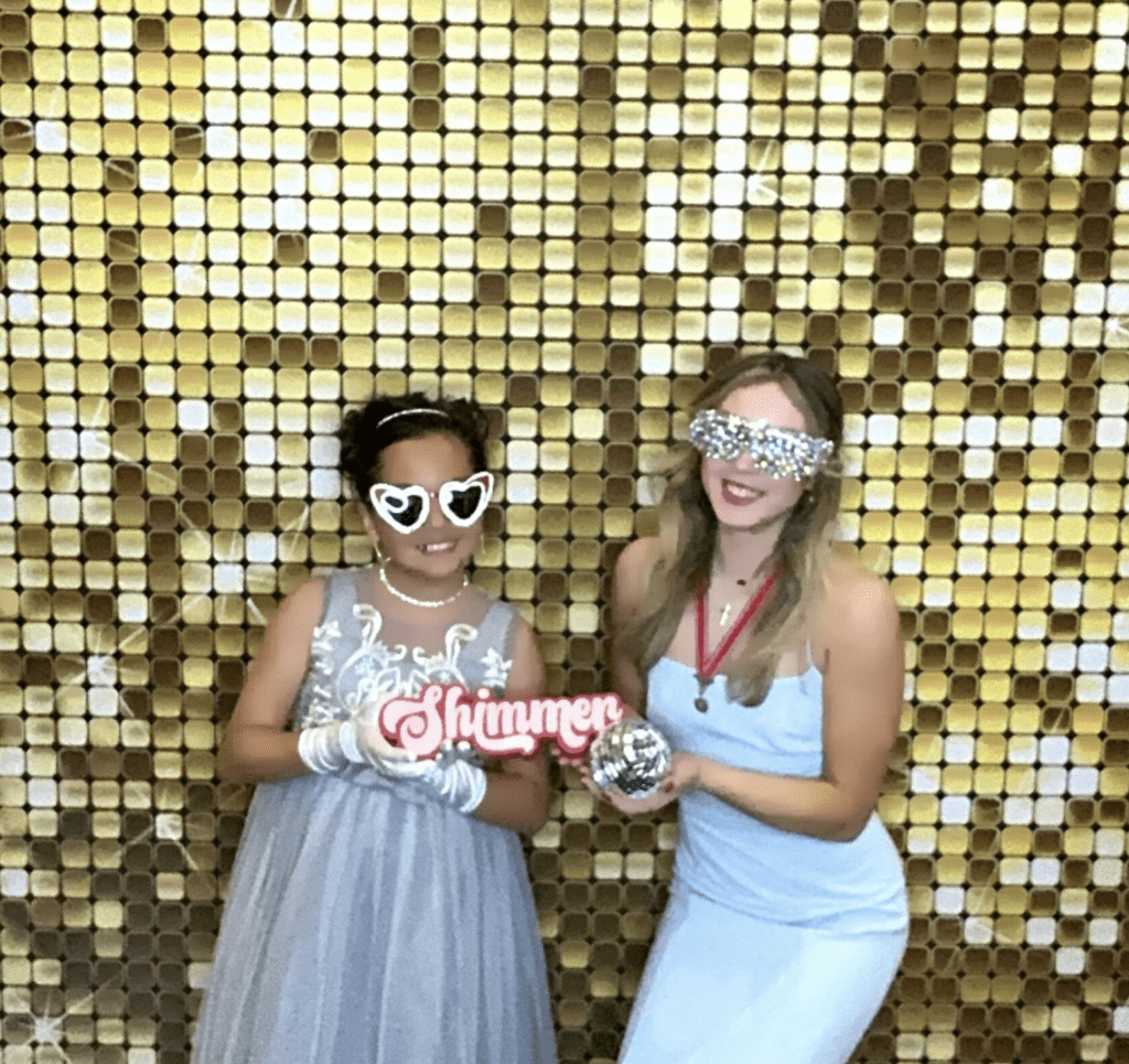 2 young girls at the Children of the American Revolution - State Conference in Temple TX having fun in our photo booth